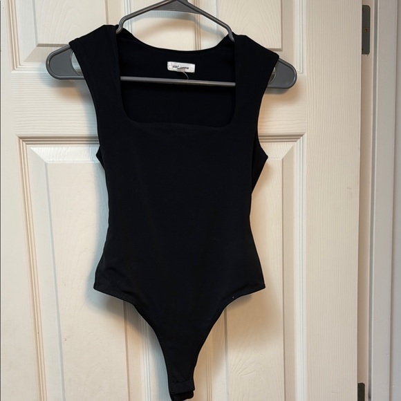 Stitch & Pine Tops - Elegant Black Bodysuit with Classic Design